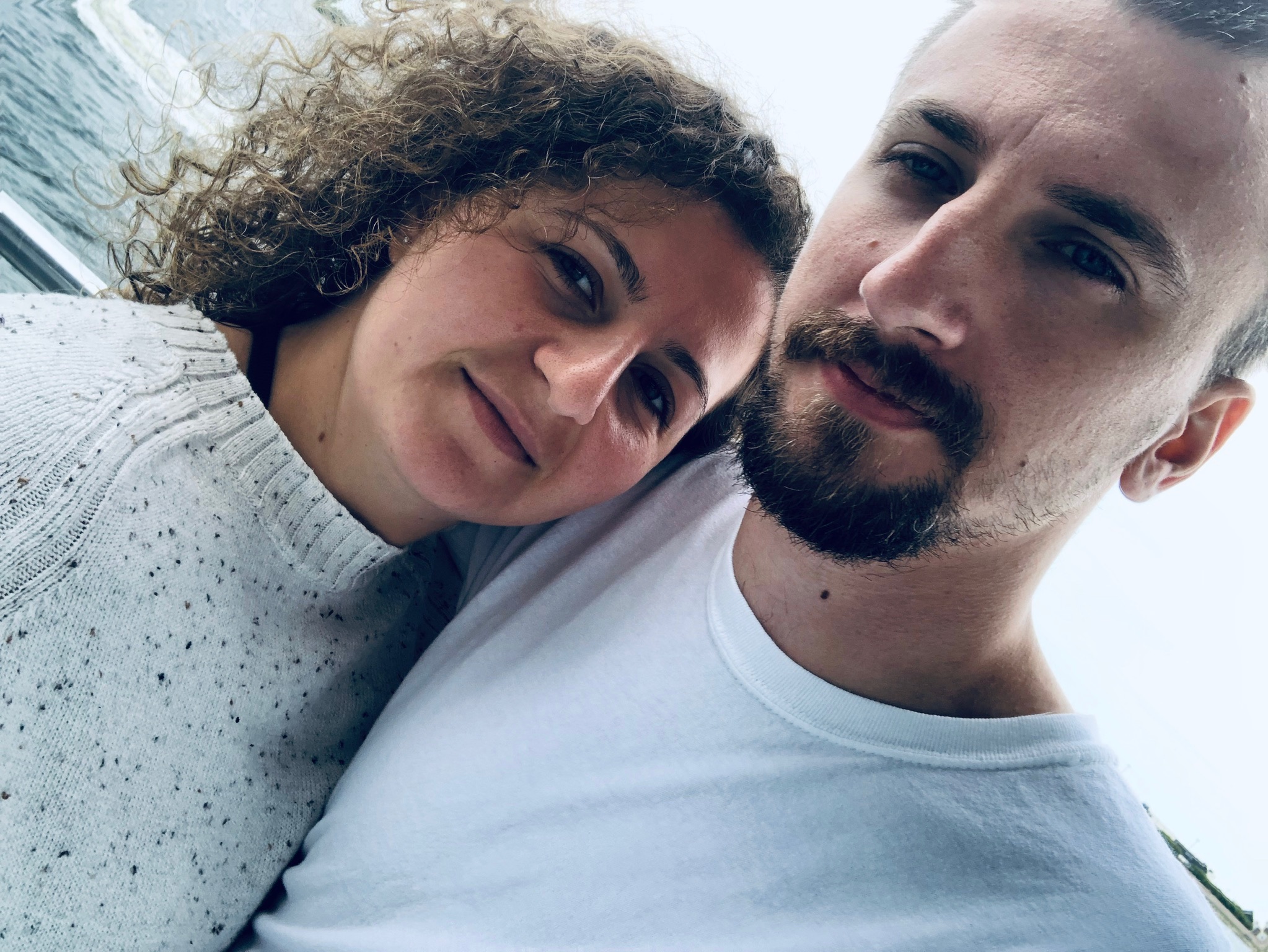 Adam and Emirjeta cheek to cheek, close up