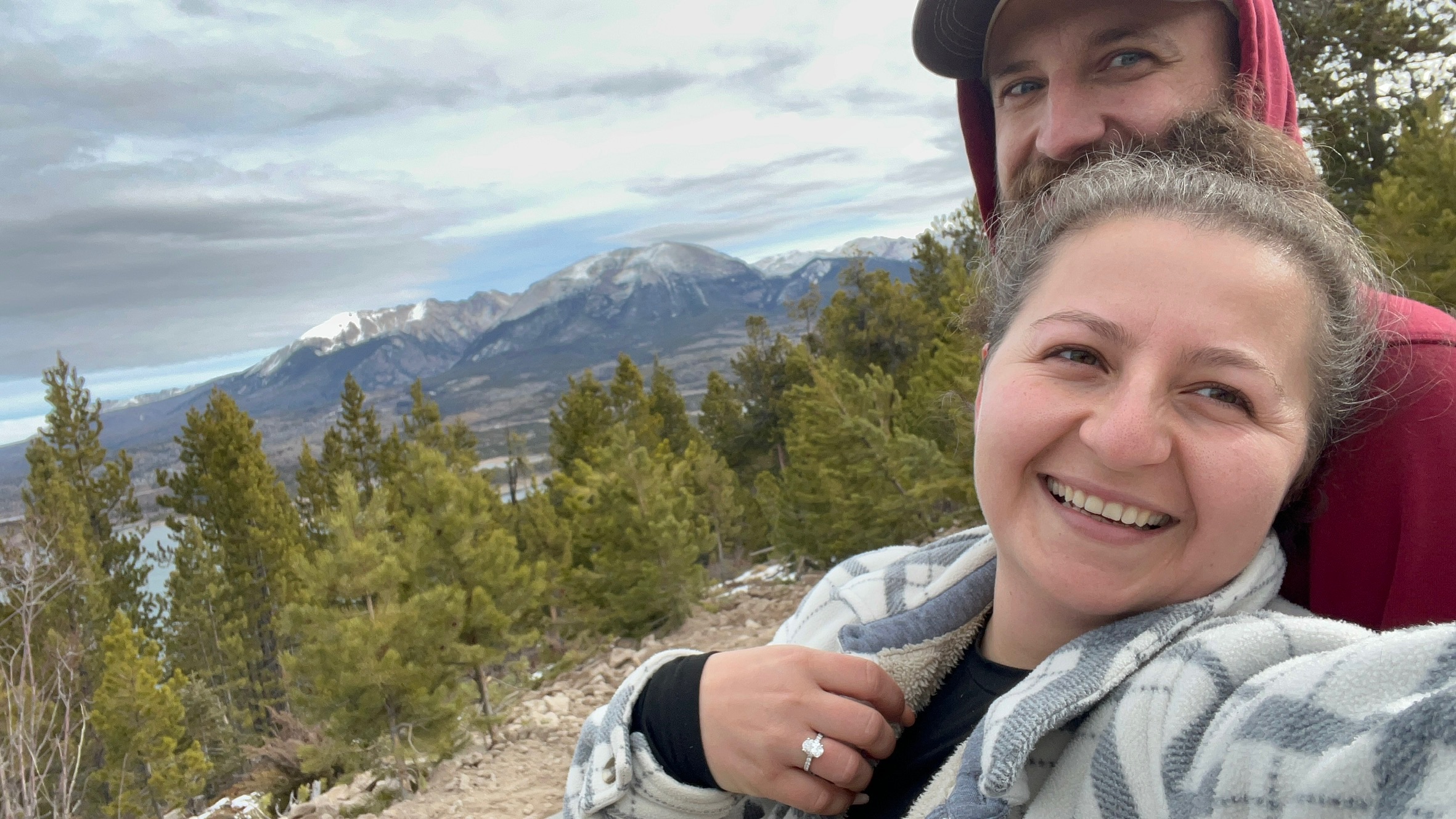 Laughing together by a mountain lake